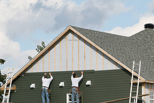 Professional Storm Damage Siding Repair technician working in Vandalia, IL